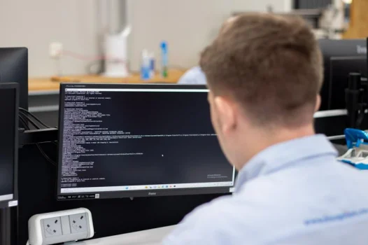 man using computer for coding