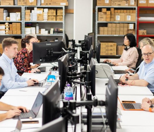 people at desks with computers