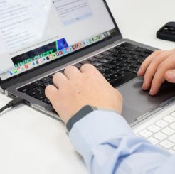 close up of man using laptop